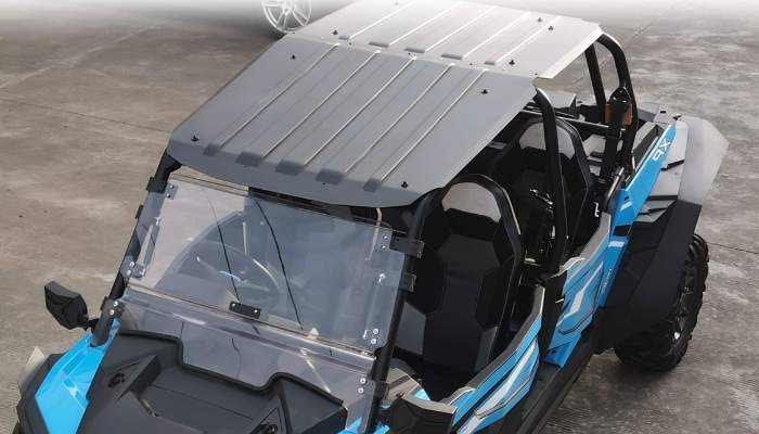 Polaris RZR Pro R side-by-side UTV with roof and windshield accessories in blue and black colors