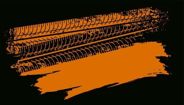 Orange tire track design on black background representing four-wheeler accessories theme