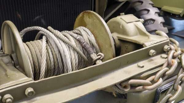 close-up of heavy-duty winch cable mounted on a winch drum for UTV installation