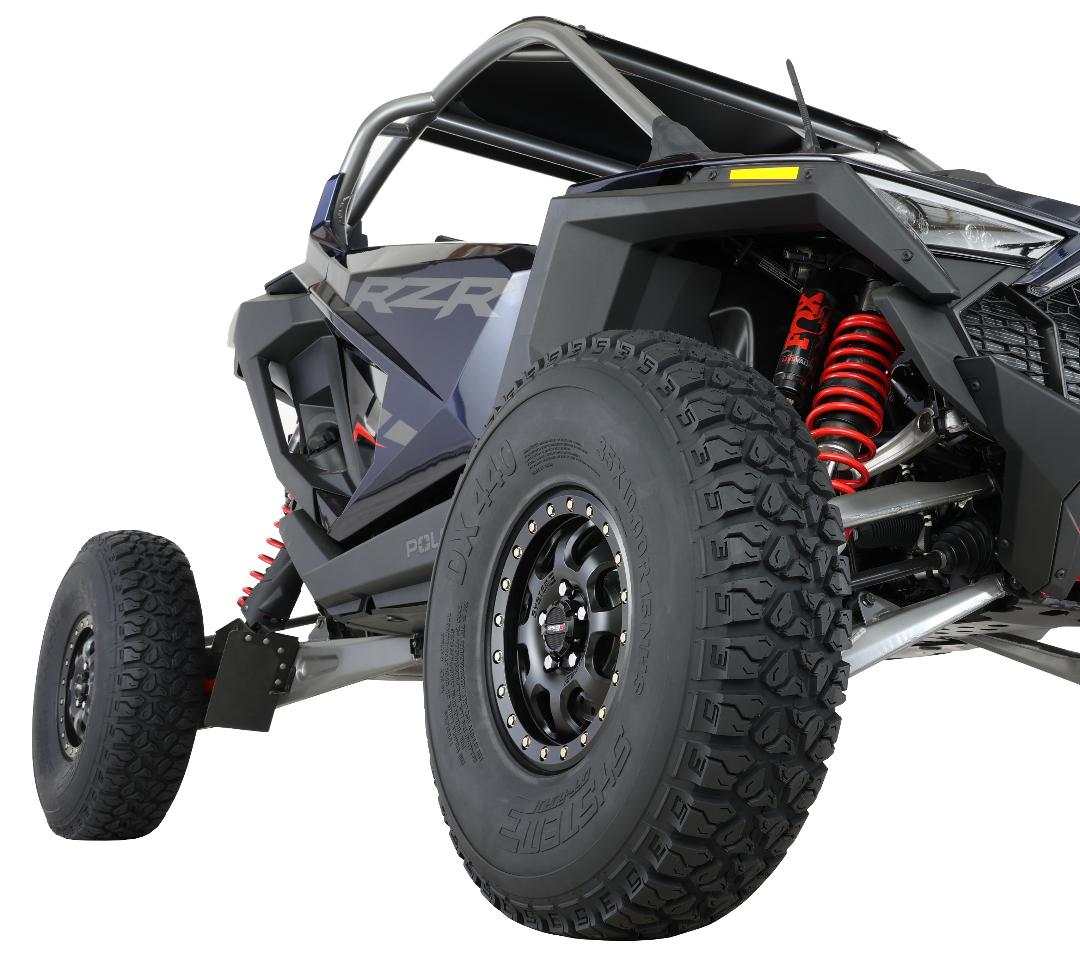 System 3 Off-Road UTV DX440 tire mounted on off-road vehicle showing aggressive tread and reinforced sidewalls