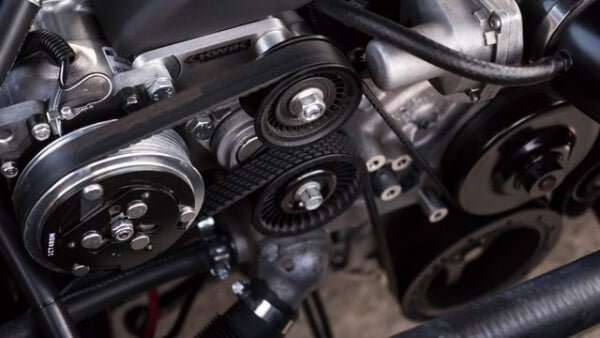 Close-up image of UTV aftermarket engine parts and belts for enhanced safety and performance upgrades