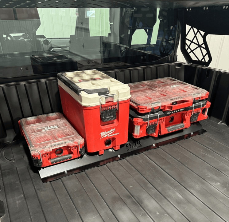 Polaris Ranger XD 1500 Front Packout Mount — A black metal front packout mount installed in the bed of a Polaris Ranger 1500XD, holding two red and gray tool boxes.