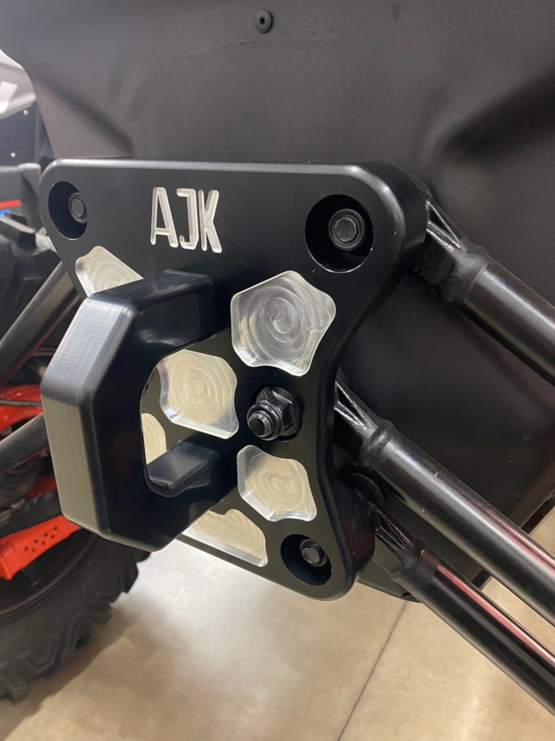 Can-Am Maverick X3 Billet Aluminum Radius Rod Plate — Can-Am X3 Billet Aluminum Radius Rod Plate by AJK Offroad Right Side View Installed with Hook