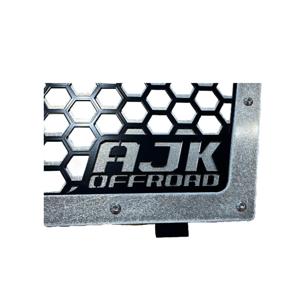 Kawasaki KRX Front Grille — Kawasaki KRX Front Grill by AJK Offroad in Raw Aluminum Close Up of Logo